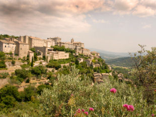 Provence bicycle trips - View across the valley to the hill-top village of Gordes.